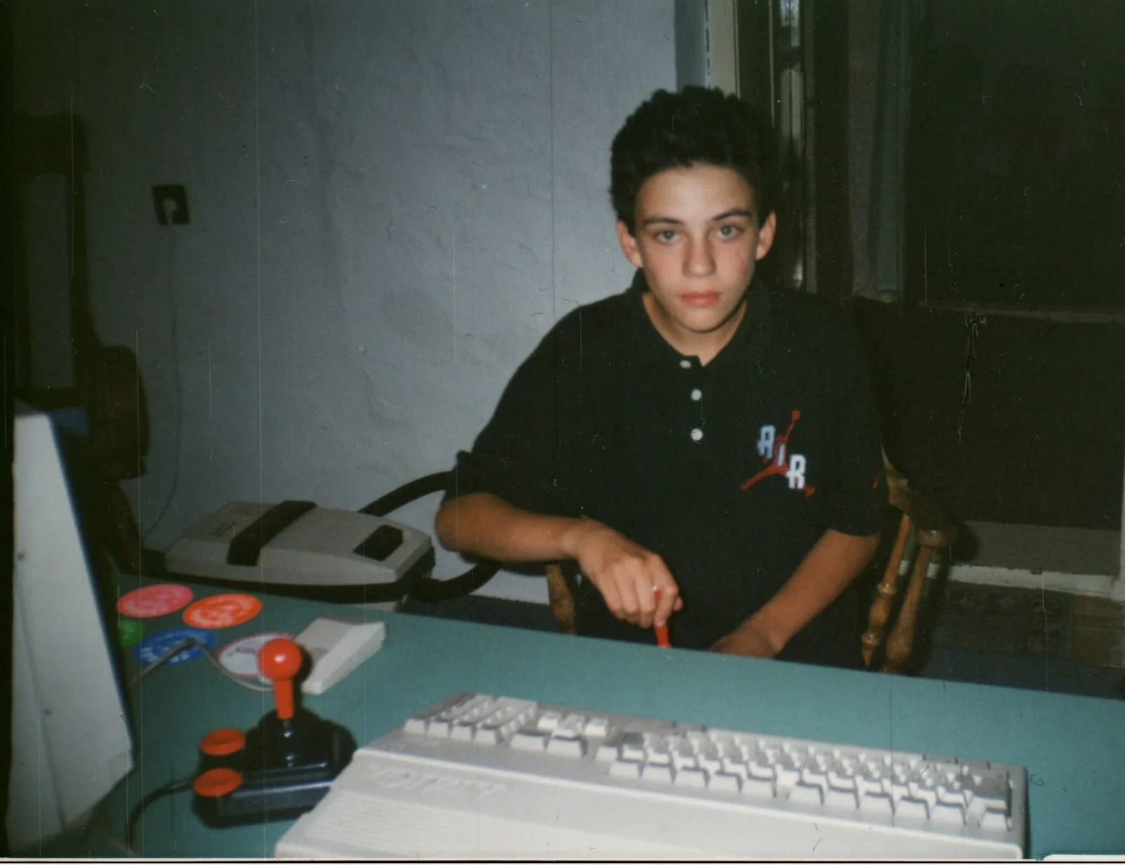Young Vuk at the Amiga 500, joystick in hand